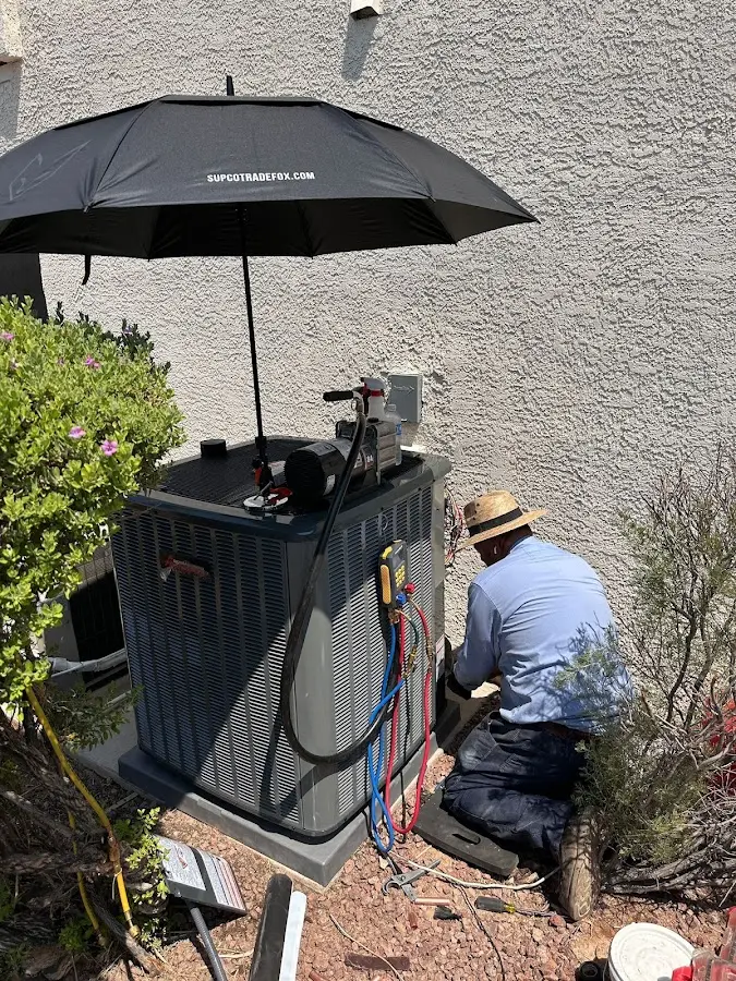 HVAC technician performing outdoor AC maintenance in Social Circle